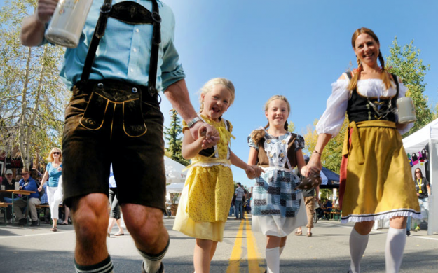 Oktoberfest Family in authentic Bavarian clothing, German Dirndl and Lederhosen